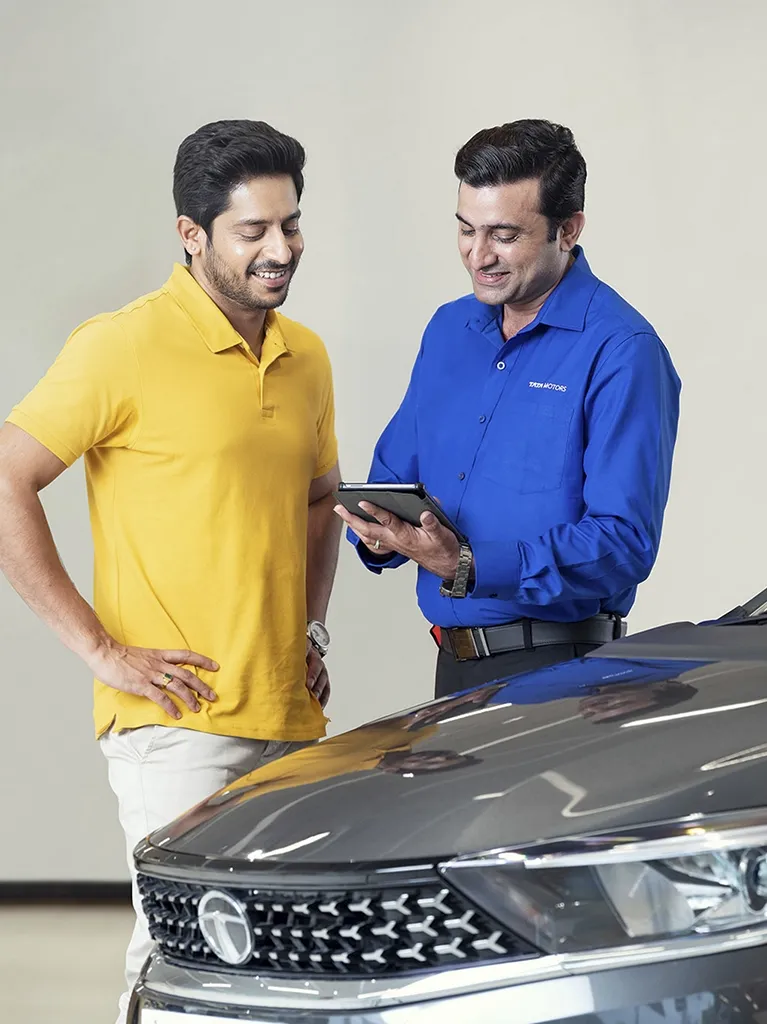 two men looking at vehicle diagnostics